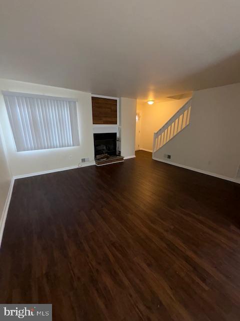 175 Valley Circle Newark, DE 19711 - Photo 7 of 17 a view of an empty room with wooden floor and a window