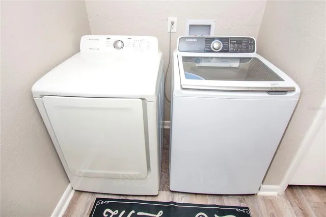 a utility room with dryer and washer