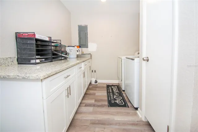 a kitchen with sink stove and cabinets