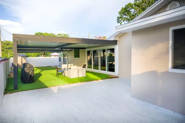 a view of an house with swimming pool and porch
