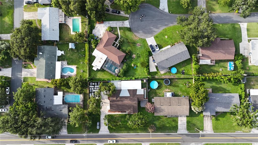 1504 Hallam Drive Lakeland, FL 33813 - Photo 31 of 34 an aerial view of multiple houses with yard