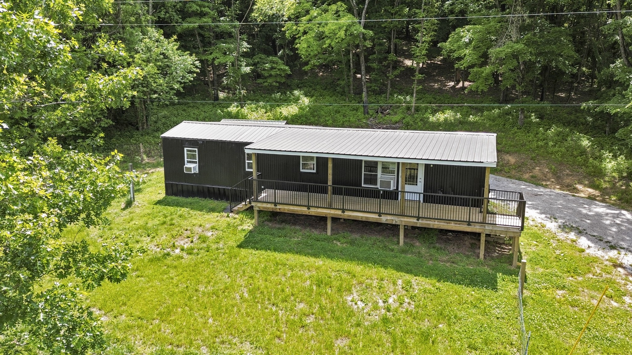4455 Browning Branch Road Bethpage, TN 37022 - Photo 2 of 19 a view of a house with a yard from a lake view