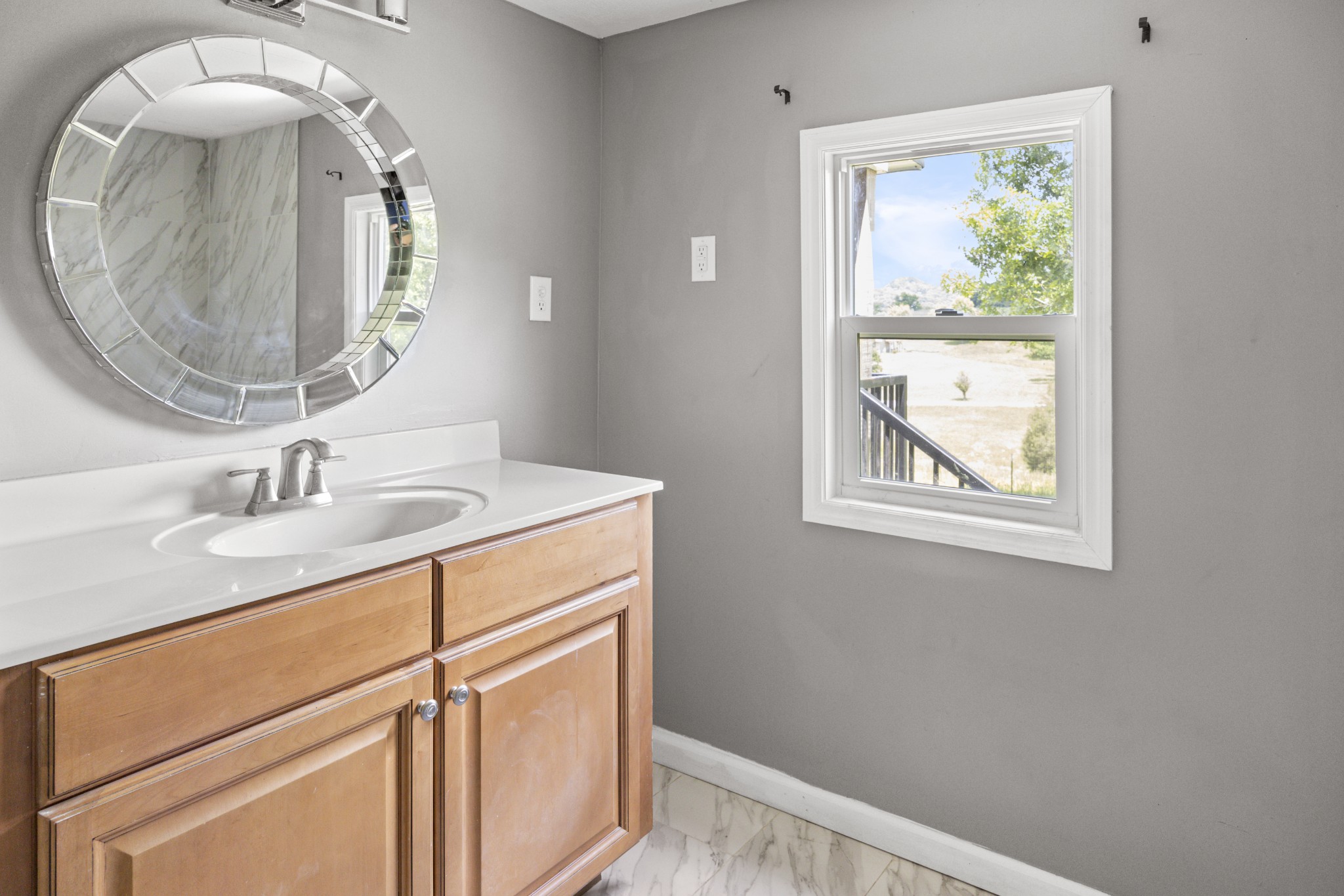 4455 Browning Branch Road Bethpage, TN 37022 - Photo 8 of 19 a bathroom with a sink and a mirror