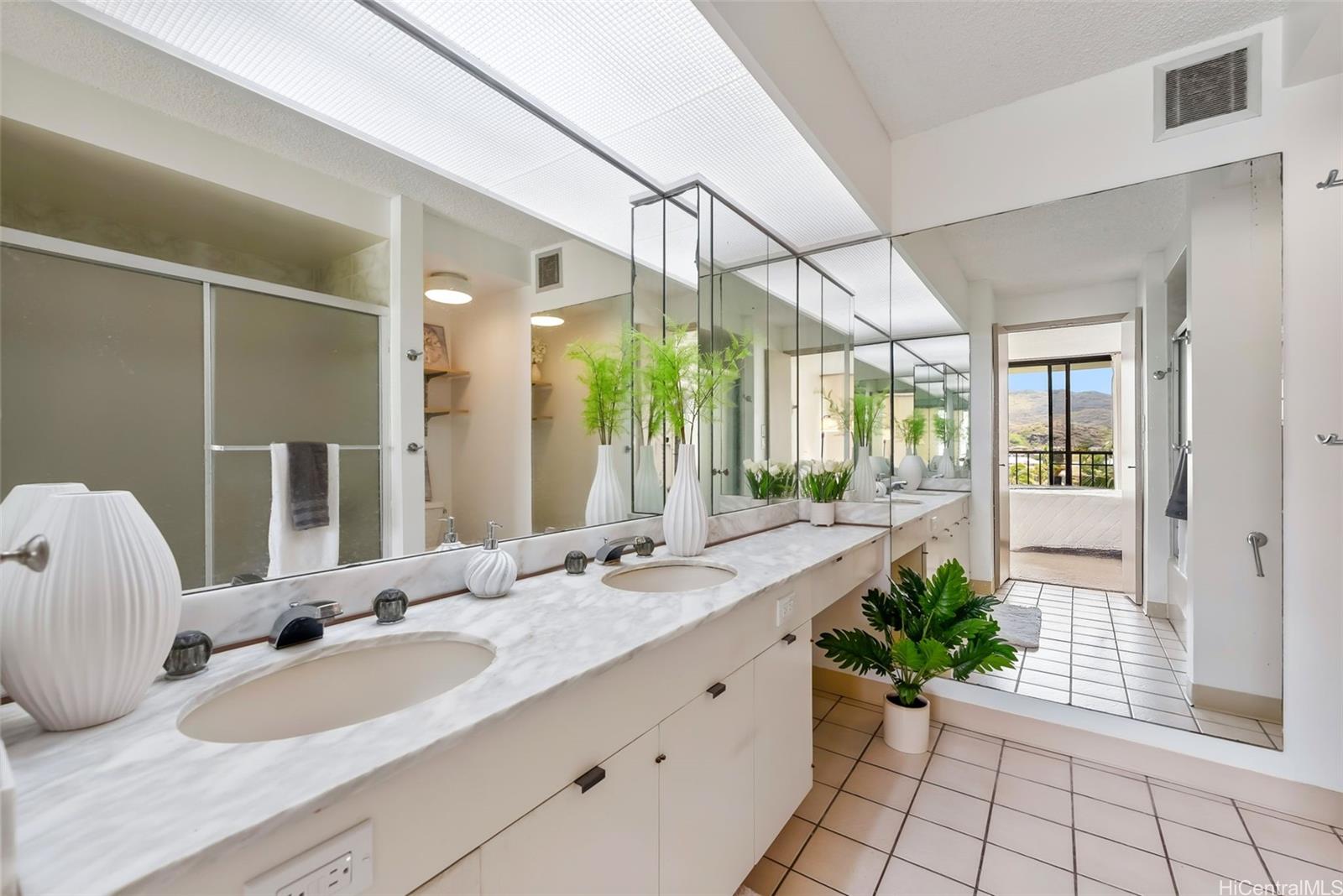 500 Lunalilo Home Road, Unit 25B Honolulu, HI 96825 - Photo 12 of 23 a bathroom with a granite countertop sink and a mirror