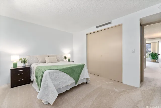 a bedroom with a bed and a cabinets