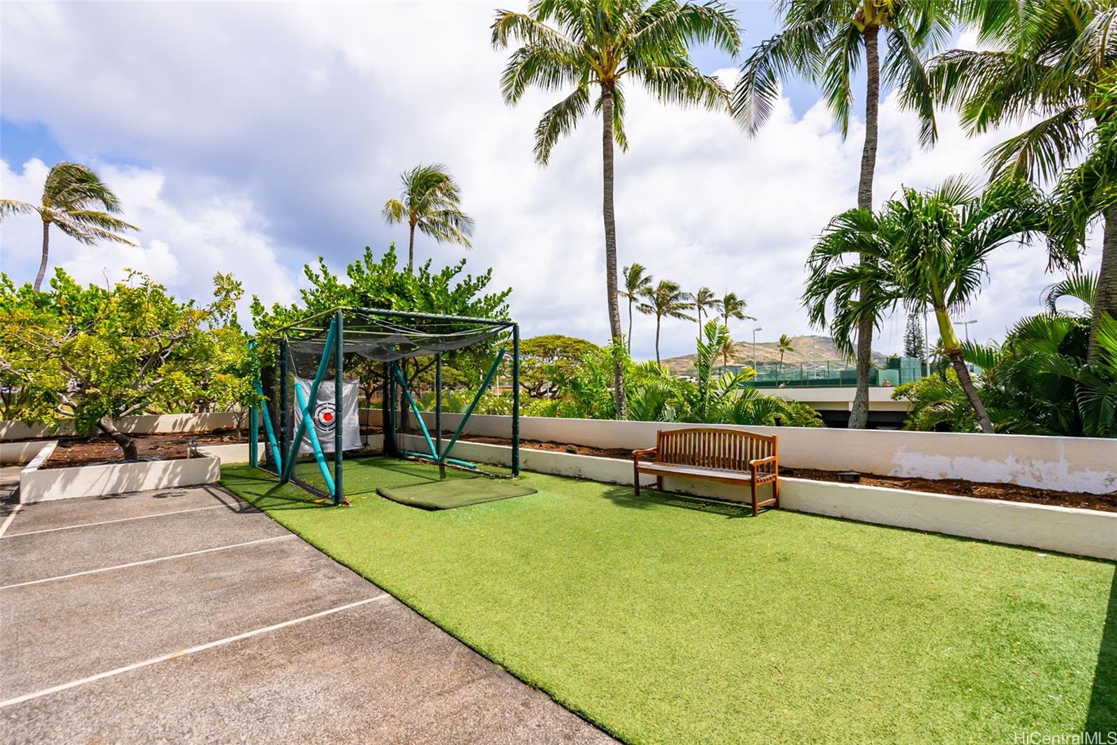 500 Lunalilo Home Road, Unit 25B Honolulu, HI 96825 - Photo 20 of 23 a view of swimming pool with a table and chairs