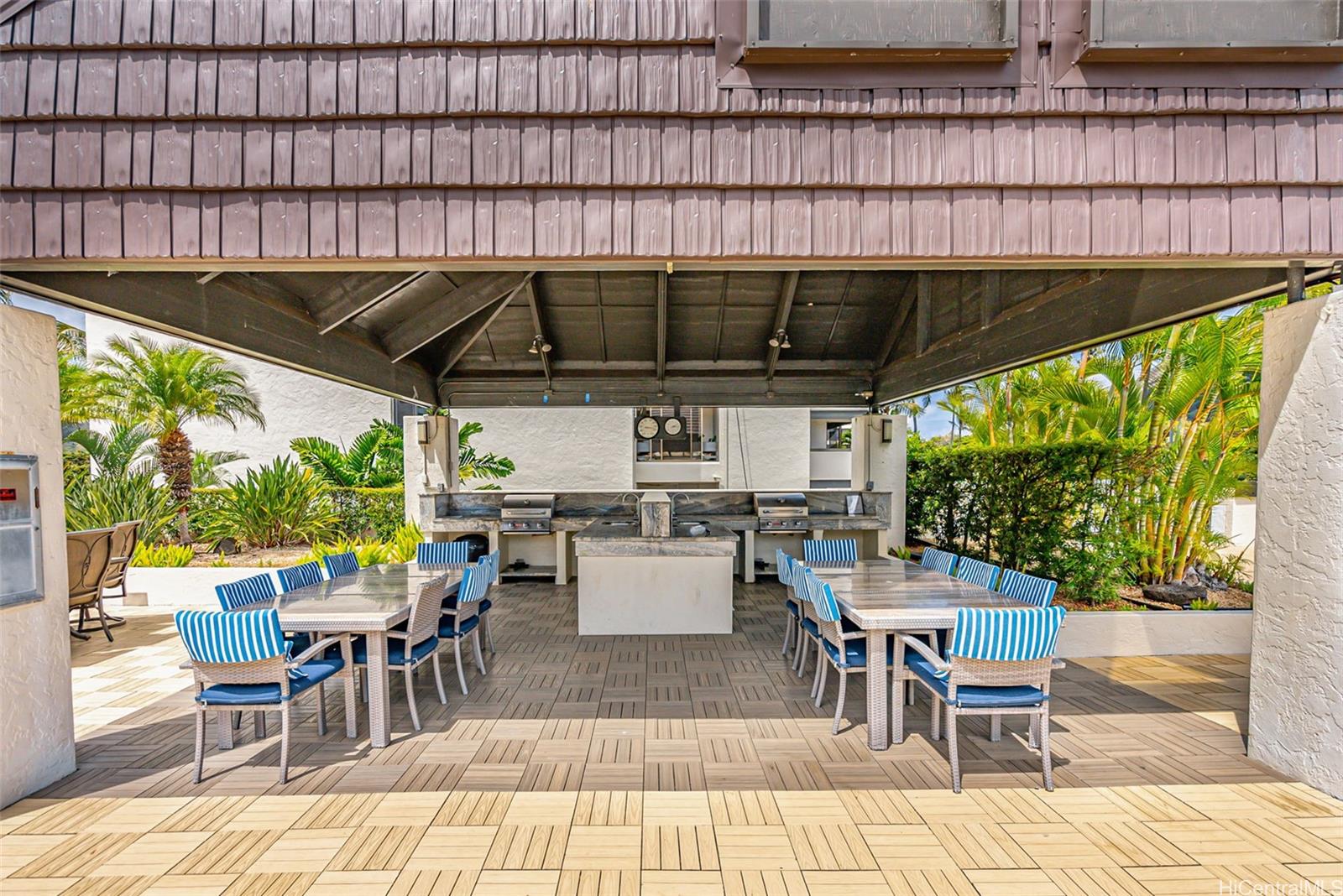 500 Lunalilo Home Road, Unit 25B Honolulu, HI 96825 - Photo 23 of 23 a view of a patio with a table and chairs
