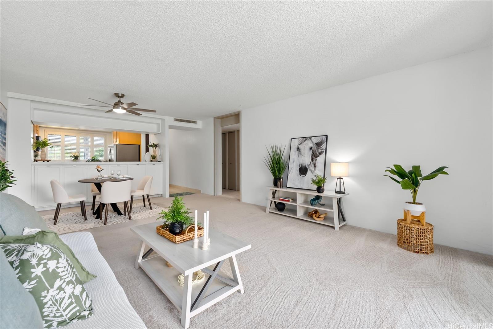 500 Lunalilo Home Road, Unit 25B Honolulu, HI 96825 - Photo 7 of 23 a living room with furniture and a potted plant