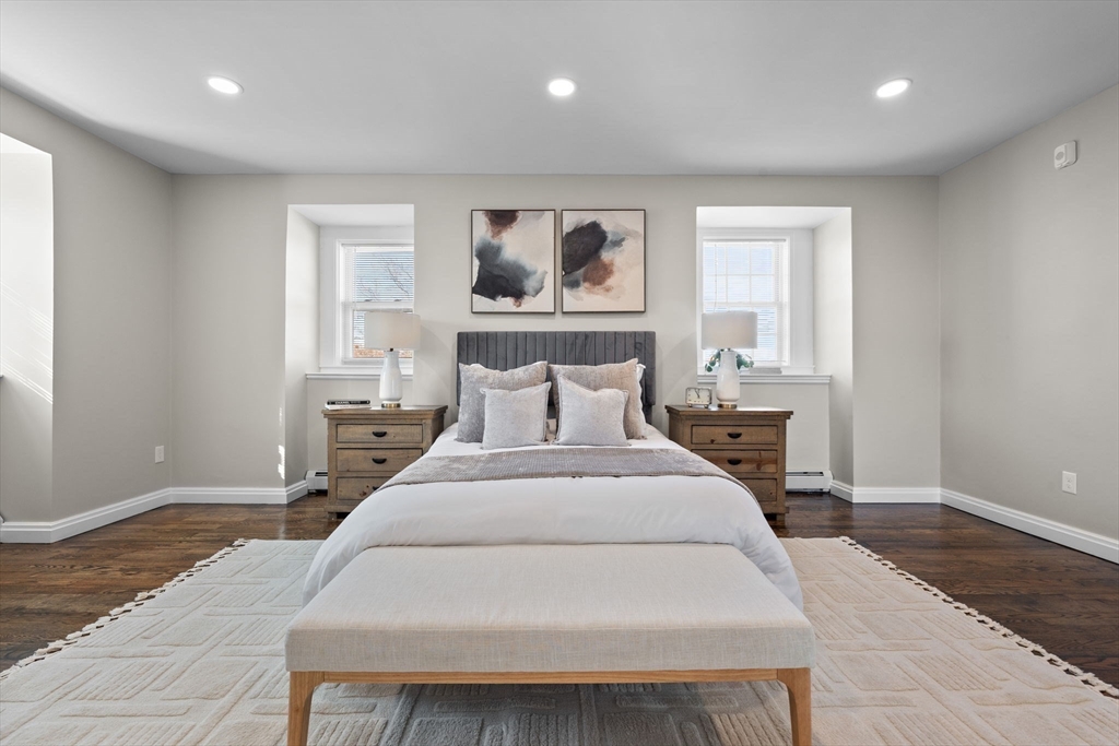 62 Chestnut Street, Unit 2 Saugus, MA 01906 - Photo 11 of 22 a bedroom with a bed and wooden floor