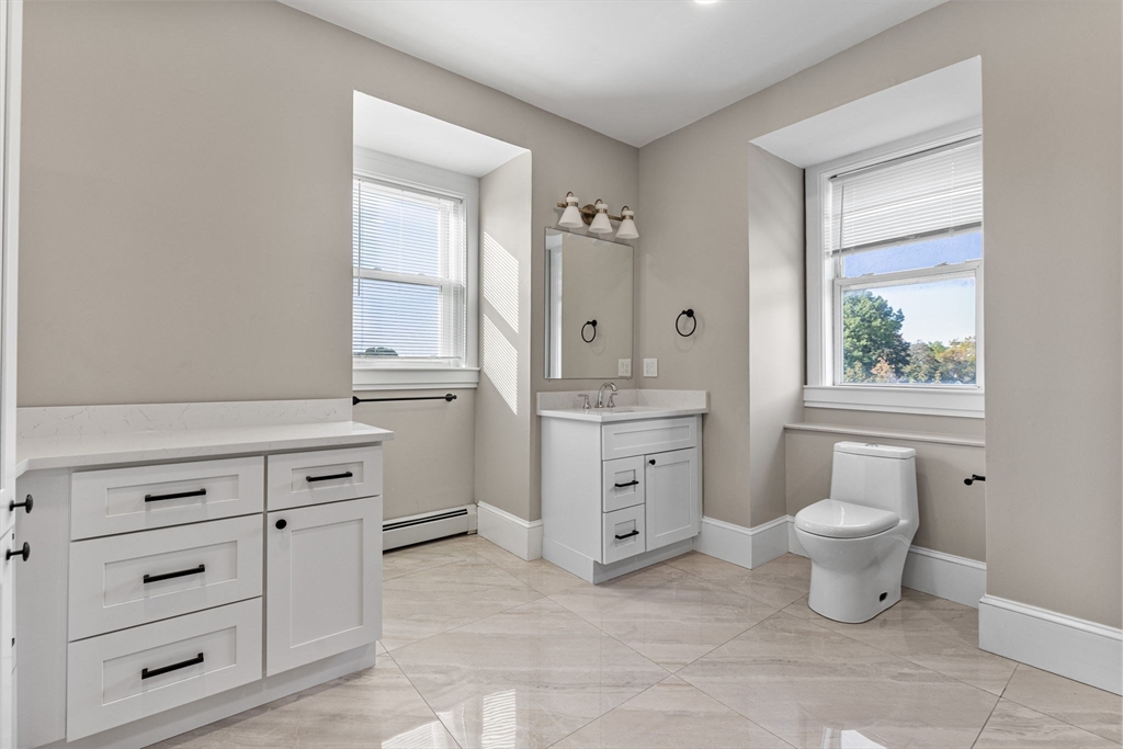 62 Chestnut Street, Unit 2 Saugus, MA 01906 - Photo 15 of 22 a bathroom with a toilet sink and a window