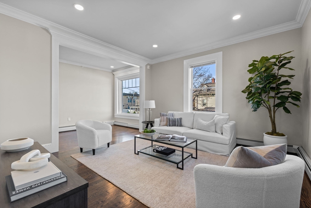 62 Chestnut Street, Unit 2 Saugus, MA 01906 - Photo 2 of 22 a living room with furniture and a potted plant