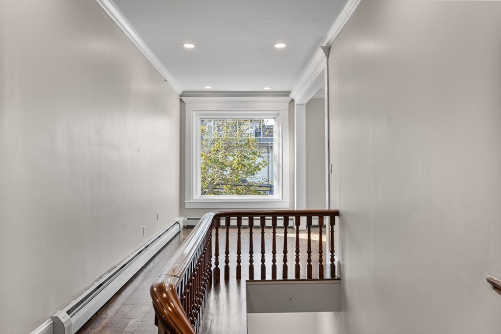 62 Chestnut Street, Unit 2 Saugus, MA 01906 - Photo 4 of 22 a view of a room with wooden floor and windows