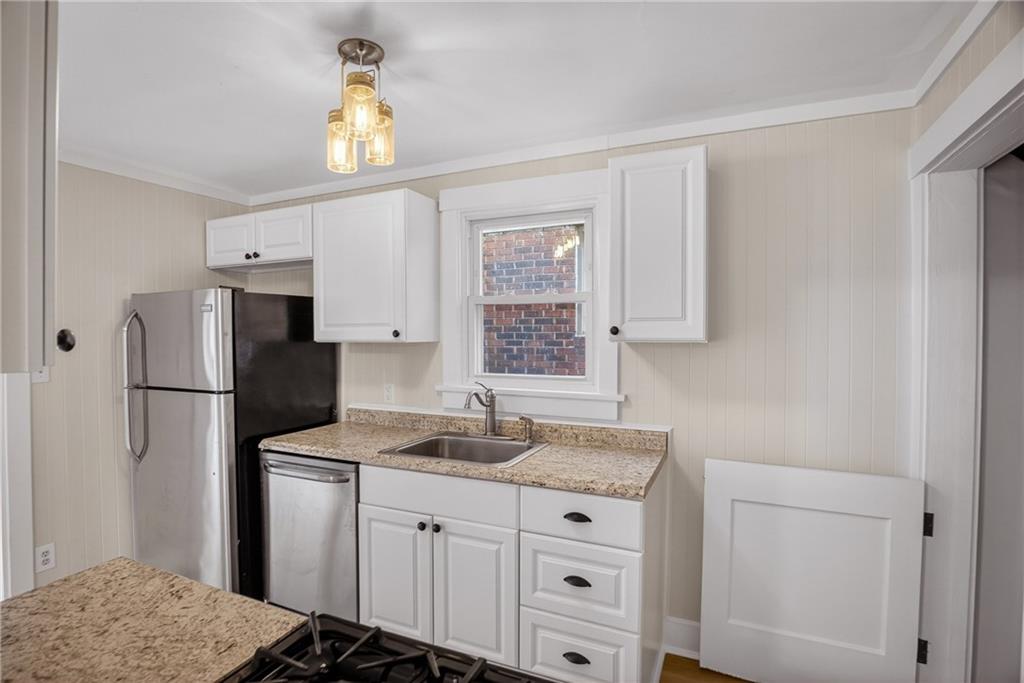 611 Montview Street Pittsburgh, PA 15214 - Photo 14 of 39 a kitchen with appliances a sink and a window