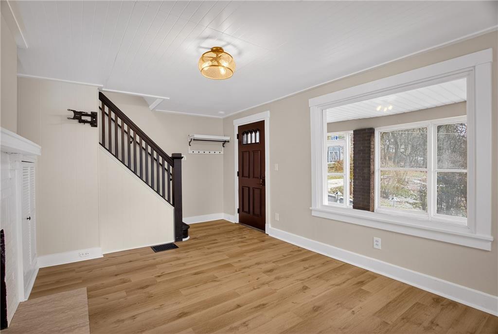 611 Montview Street Pittsburgh, PA 15214 - Photo 19 of 39 a view of an empty room with wooden floor and a window