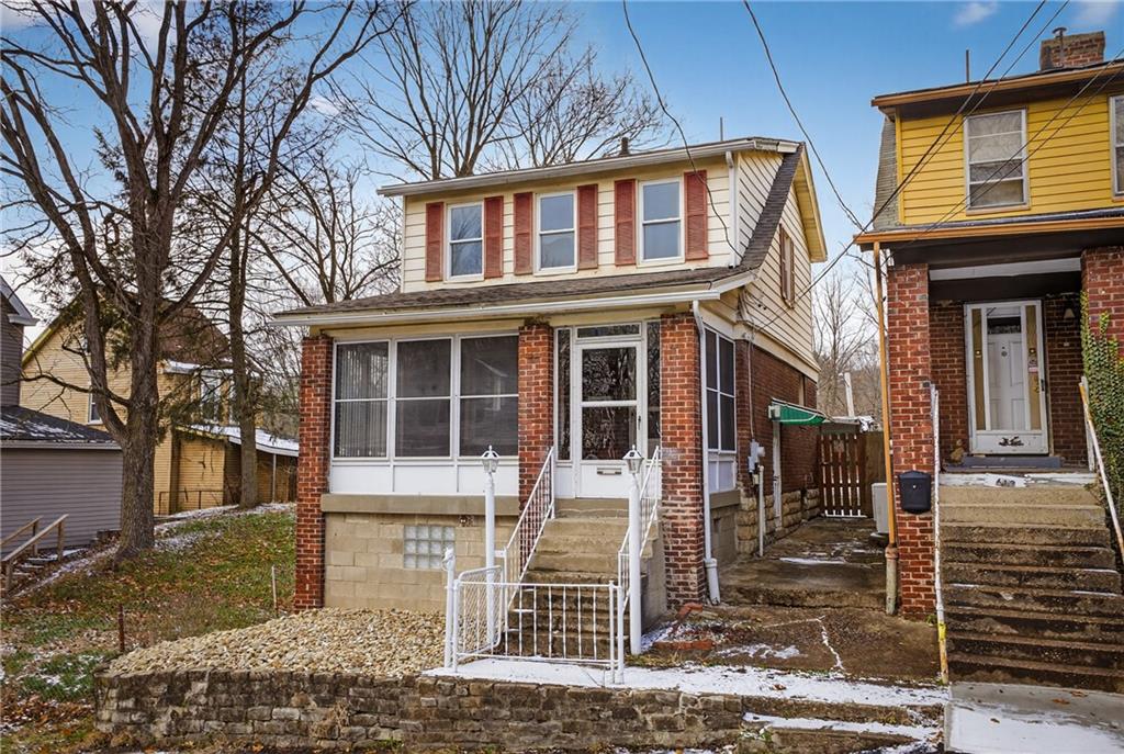 611 Montview Street Pittsburgh, PA 15214 - Photo 2 of 39 a front view of a house with glass windows