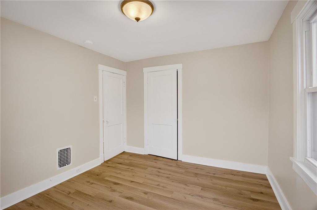 611 Montview Street Pittsburgh, PA 15214 - Photo 21 of 39 a view of an empty room with wooden floor