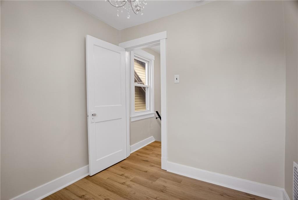 611 Montview Street Pittsburgh, PA 15214 - Photo 25 of 39 a view of an empty room with wooden floor