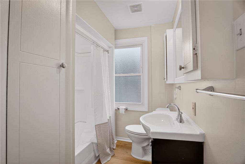 611 Montview Street Pittsburgh, PA 15214 - Photo 26 of 39 a bathroom with a sink toilet and mirror