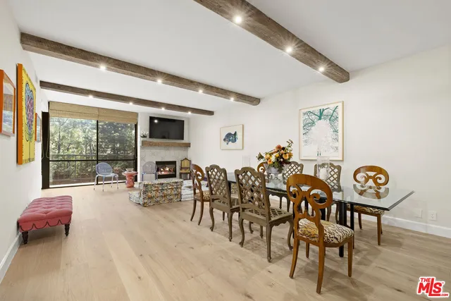 a lobby with furniture and floor to ceiling window