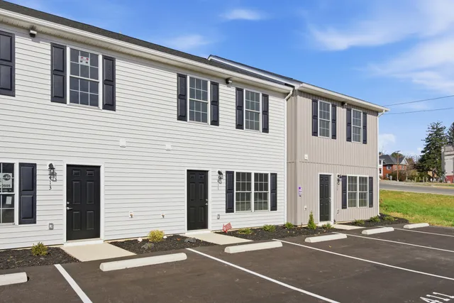 a front view of a house with a outdoor space