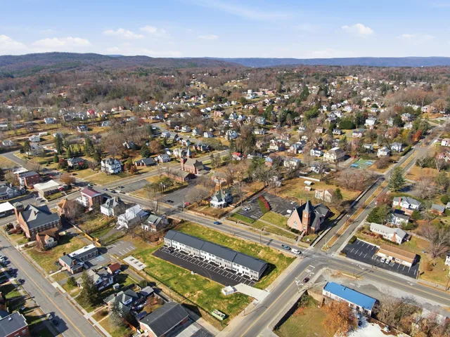 an aerial view of residential houses with outdoor space