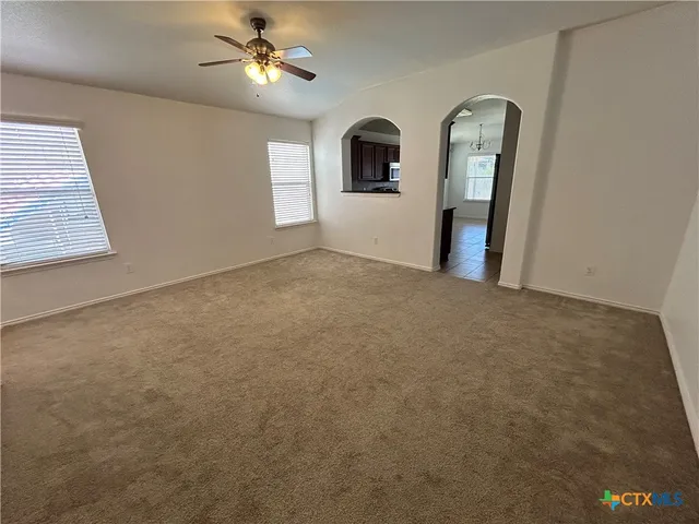 a view of empty room with windows