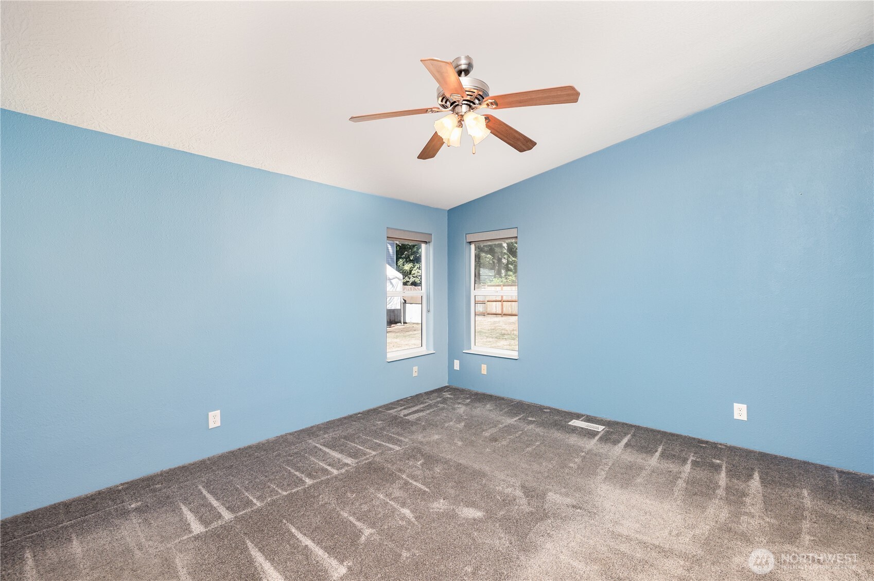 217 172nd Place Southwest Bothell, WA 98012 - Photo 18 of 31 wooden floor in an empty room with a window