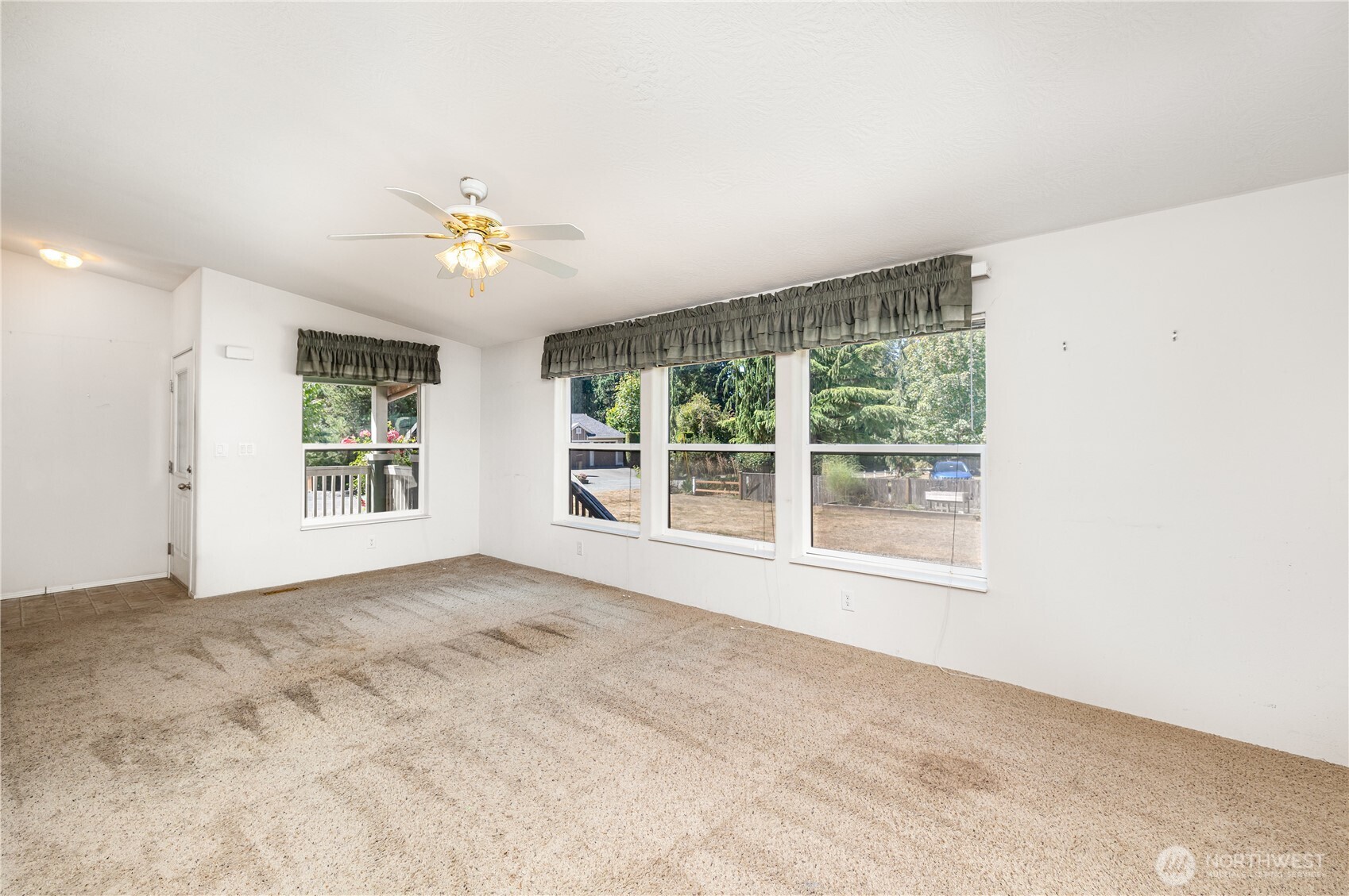217 172nd Place Southwest Bothell, WA 98012 - Photo 6 of 31 a view of an empty room with a window