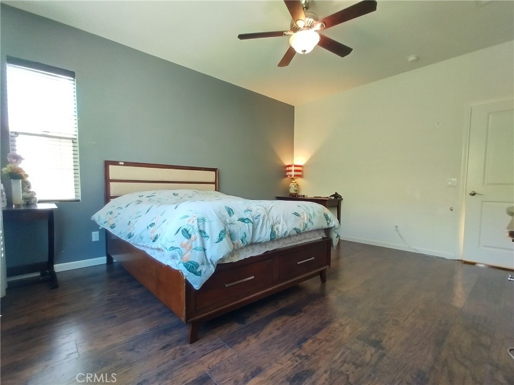 11811 Cramer Road Yucaipa, CA 92399 - Photo 30 of 56 a bedroom with a bed and window