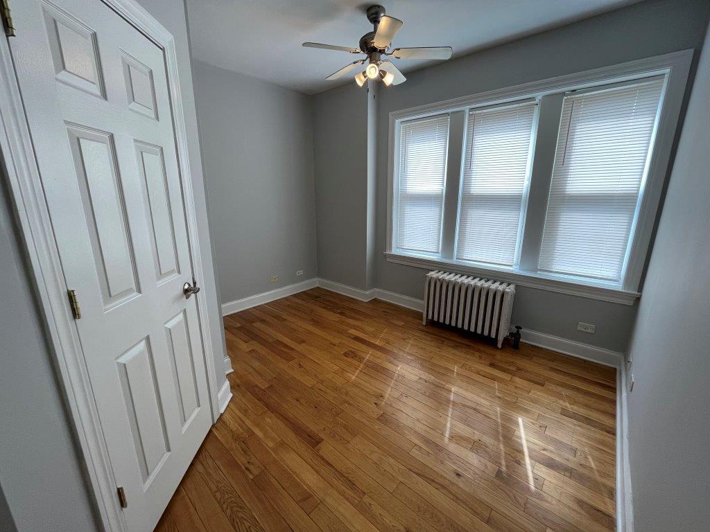 4548 West George Street, Unit 3 Chicago, IL 60641 - Photo 9 of 12 a view of an empty room with a window