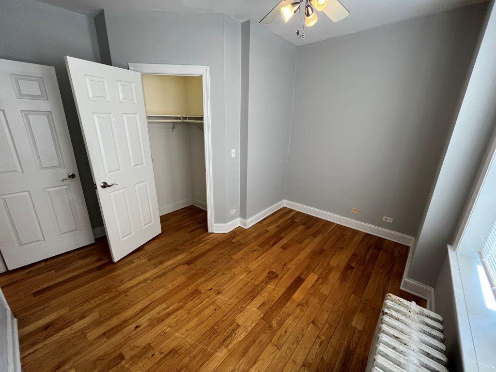 4548 West George Street, Unit 3 Chicago, IL 60641 - Photo 10 of 12 a view of a room with wooden floor and staircase