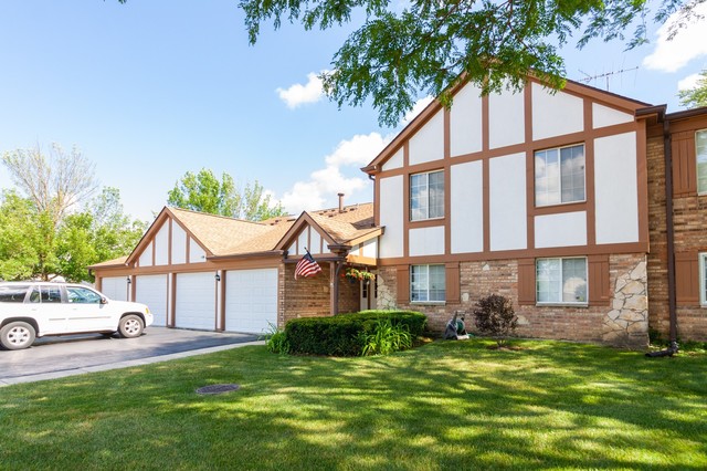 237 Memory Lane, Unit 83 Westmont, IL 60559 - Photo 1 of 16 a view of a yard in front of a house
