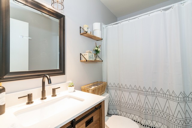 237 Memory Lane, Unit 83 Westmont, IL 60559 - Photo 12 of 16 a bathroom with a sink and a mirror