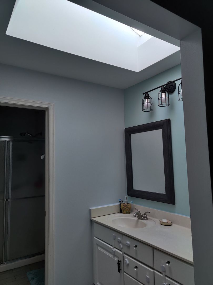 237 Memory Lane, Unit 83 Westmont, IL 60559 - Photo 16 of 16 a bathroom with a toilet sink and mirror