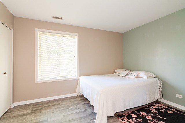 237 Memory Lane, Unit 83 Westmont, IL 60559 - Photo 10 of 16 a bedroom with a bed and a window