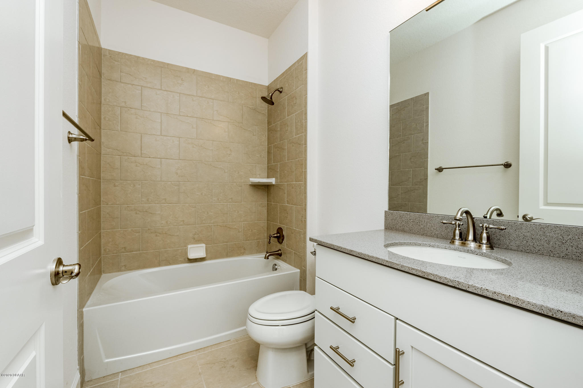 1851 Oak Place Flagler Beach, FL 32136 - Photo 15 of 31 a bathroom with a sink a toilet and a bathtub