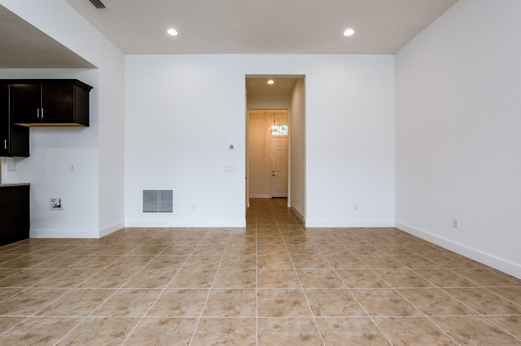 1851 Oak Place Flagler Beach, FL 32136 - Photo 16 of 31 a view of an empty room with wooden floor and a window