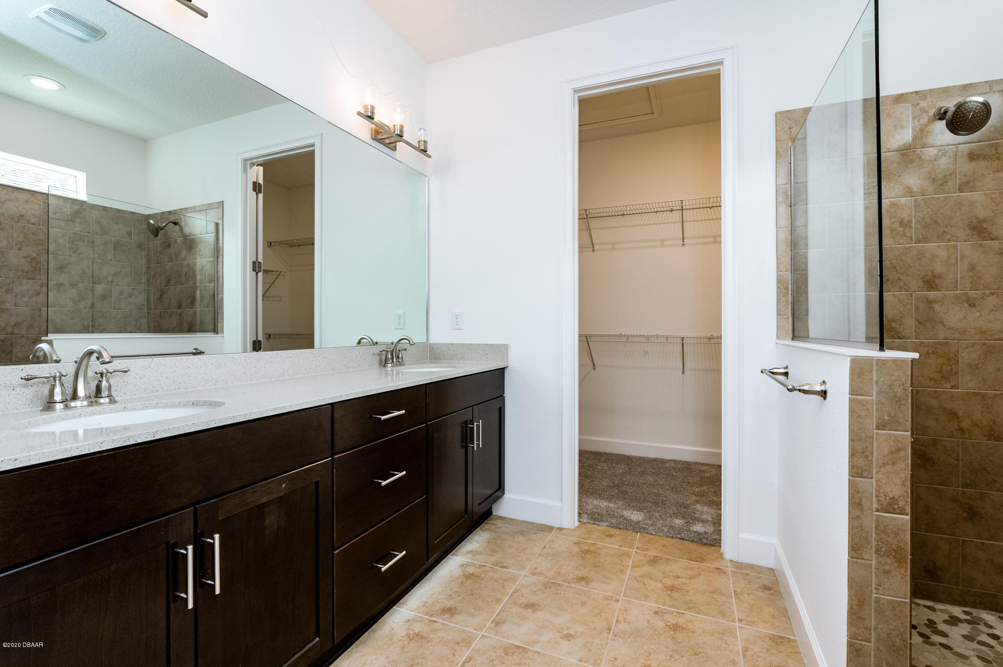 1851 Oak Place Flagler Beach, FL 32136 - Photo 21 of 31 a bathroom with a double vanity sink a and mirror