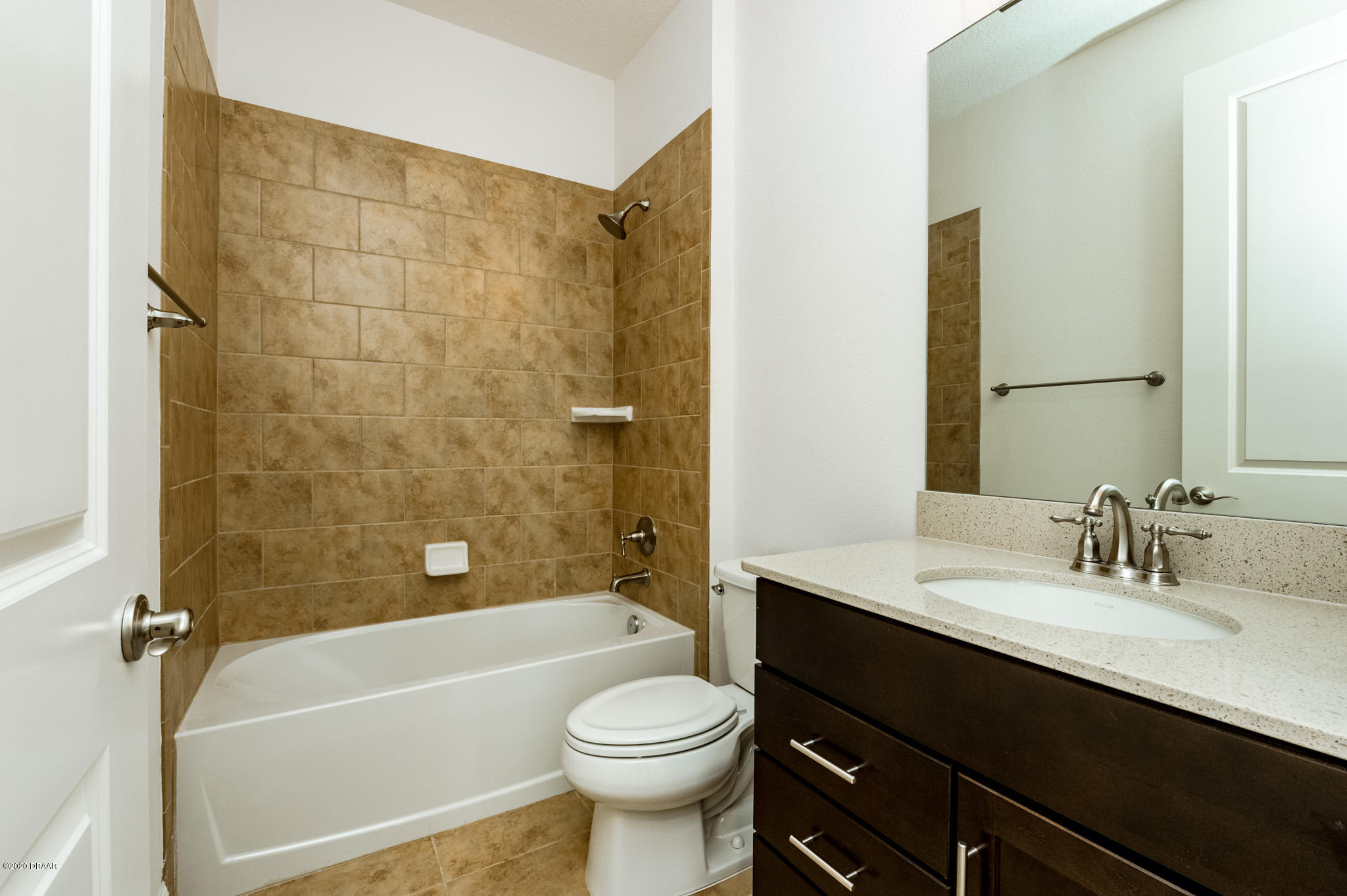 1851 Oak Place Flagler Beach, FL 32136 - Photo 24 of 31 a bathroom with a sink a toilet and a bathtub