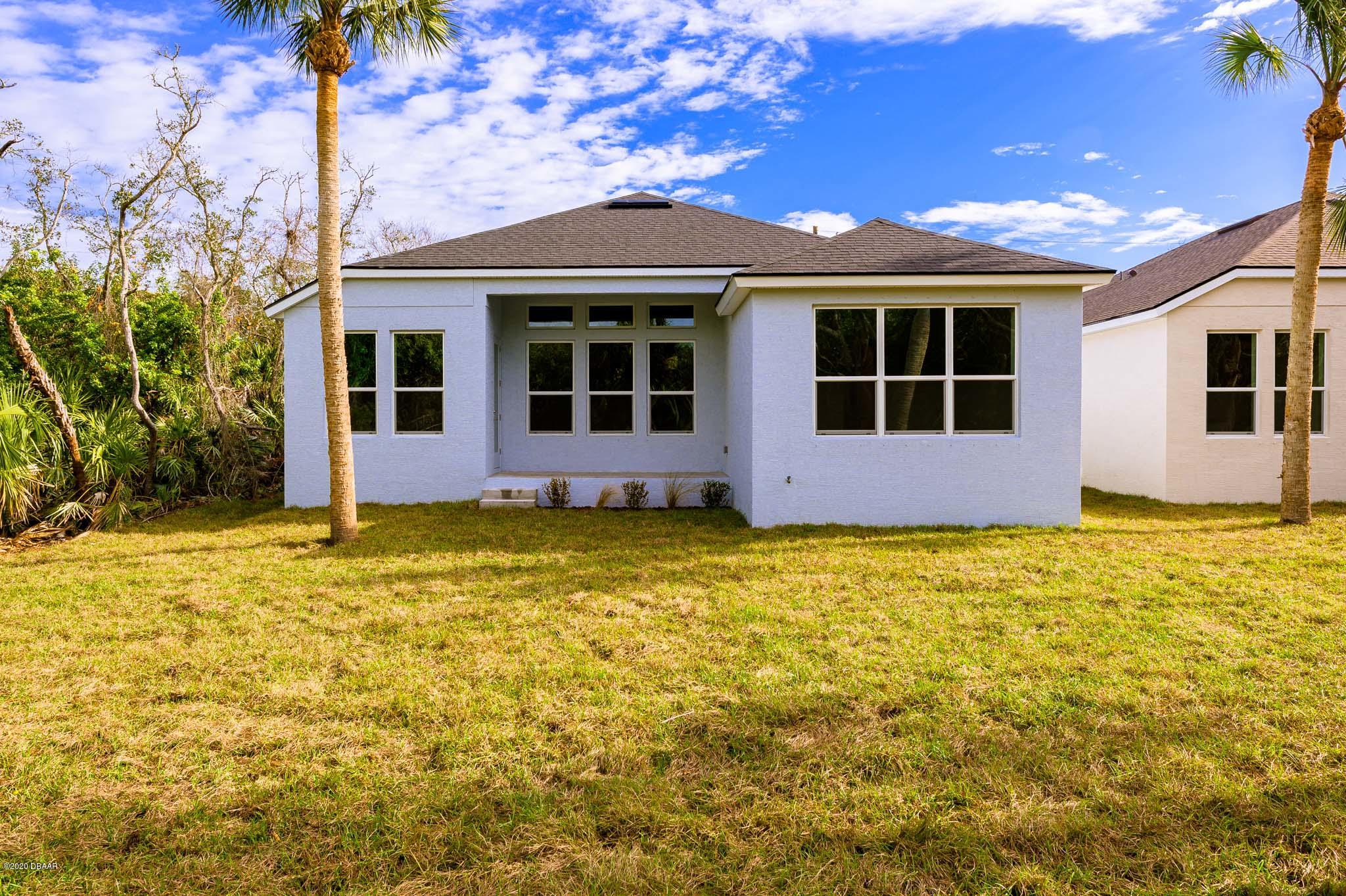 1851 Oak Place Flagler Beach, FL 32136 - Photo 7 of 31 a view of a house with a garden