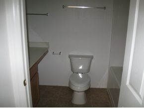 2239 Southeast Rambler Palm Bay, FL 32909 - Photo 5 of 6 a white toilet sitting next to a shower