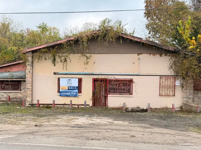a view of a house with a street