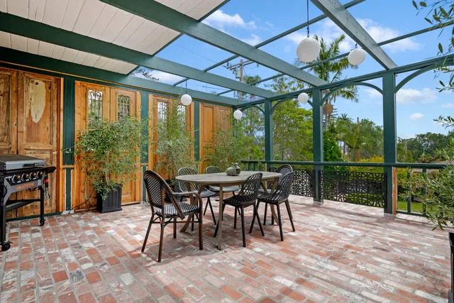 a view of a patio with a table chairs and a patio