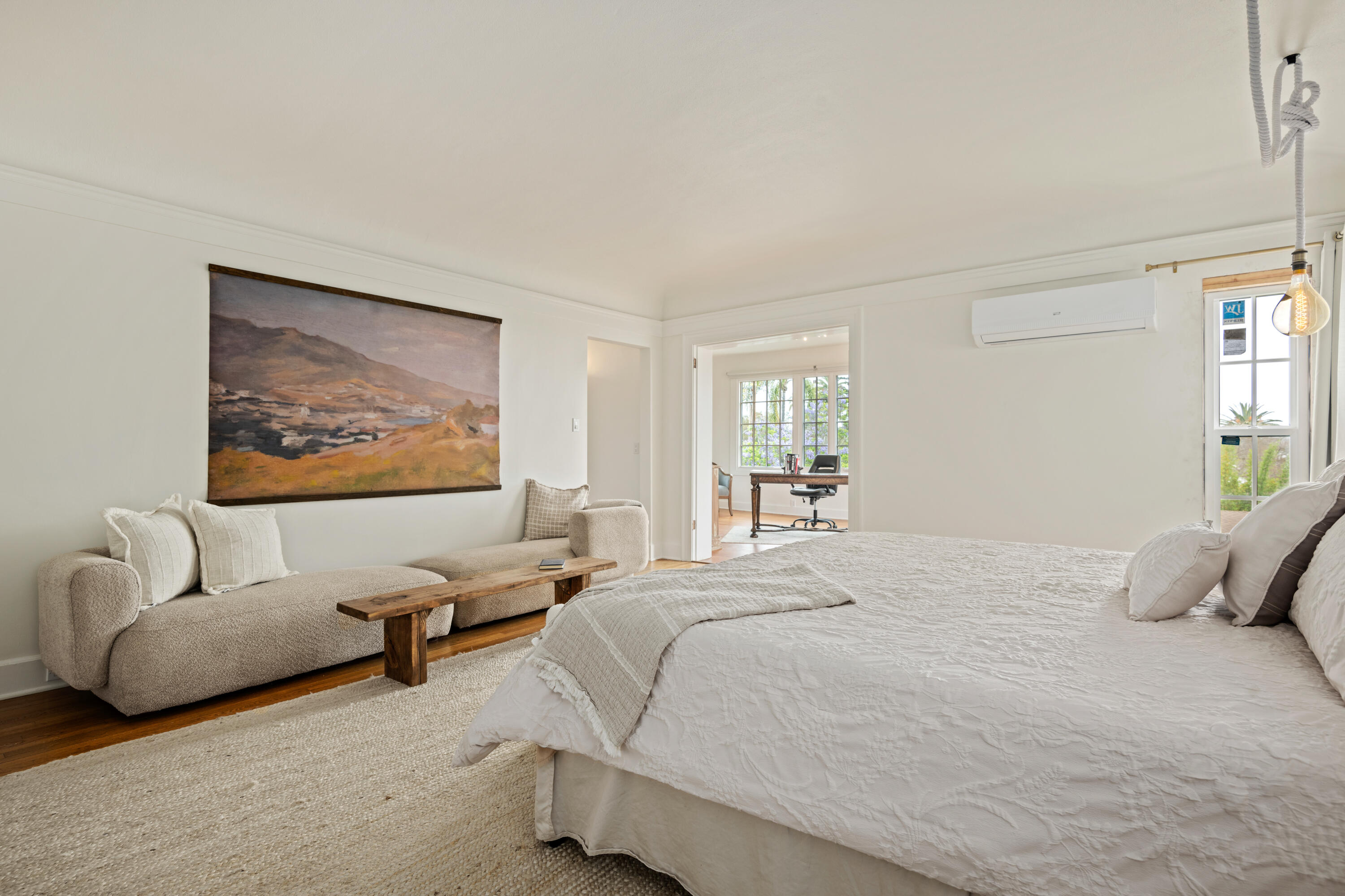 1833 Santa Barbara Street Santa Barbara, CA 93101 - Photo 14 of 34 a bedroom with a bed and glass walk in closet