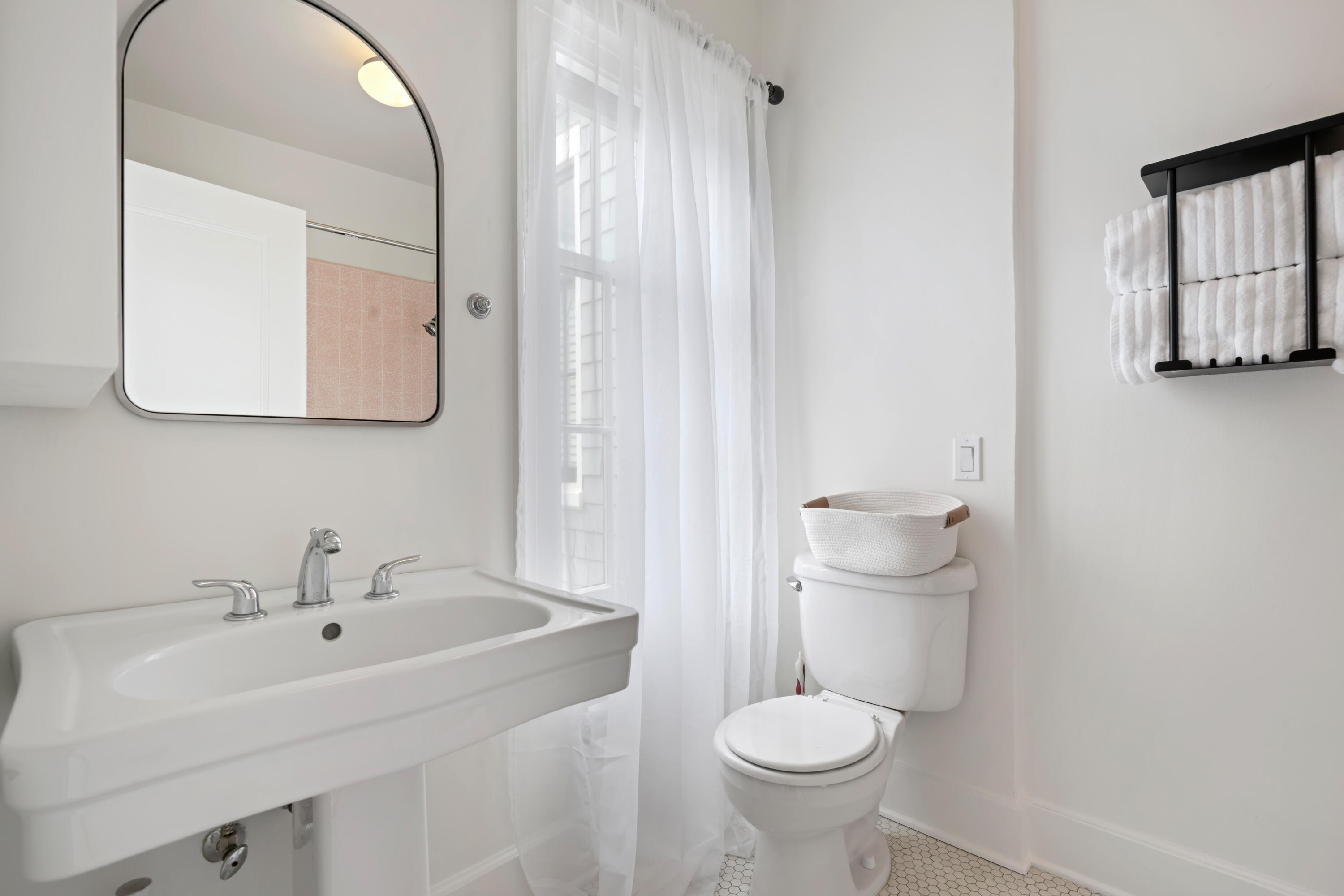 1833 Santa Barbara Street Santa Barbara, CA 93101 - Photo 21 of 34 a bathroom with a sink toilet and mirror