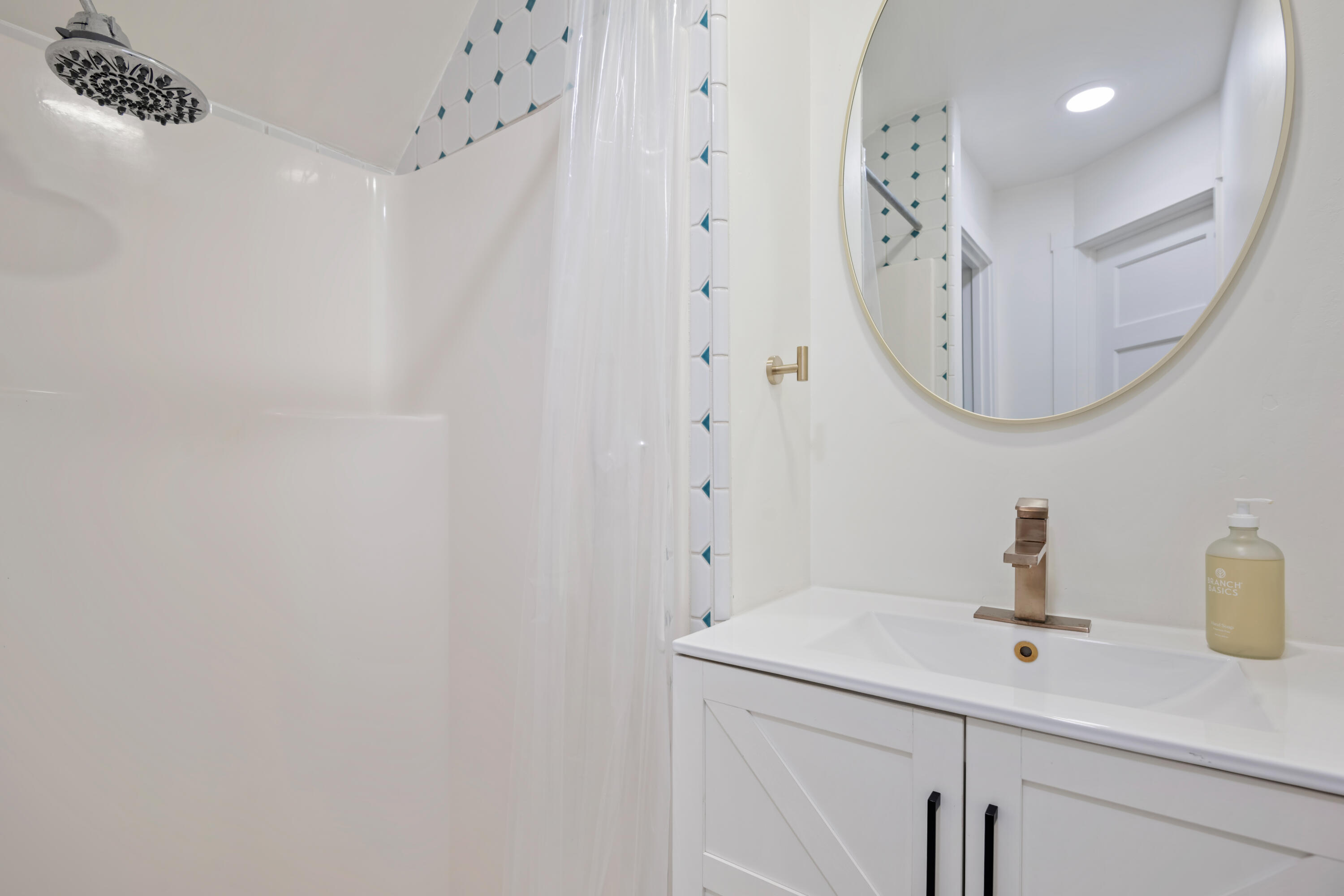 1833 Santa Barbara Street Santa Barbara, CA 93101 - Photo 26 of 34 a bathroom with a sink and a mirror