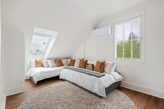 a bed room with a bed and a couch