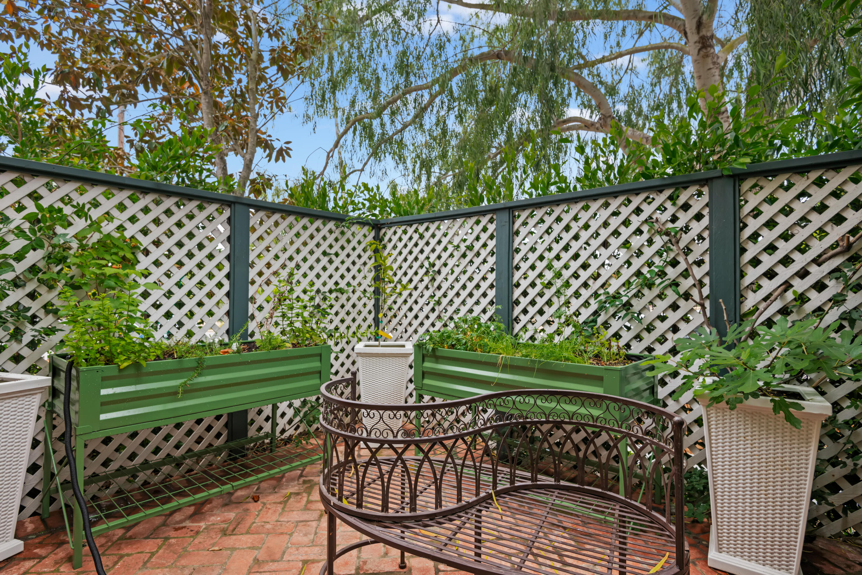 1833 Santa Barbara Street Santa Barbara, CA 93101 - Photo 33 of 34 a view of a chair and table in the garden