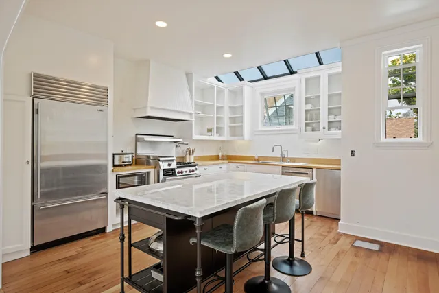 a kitchen with a table and chairs in it