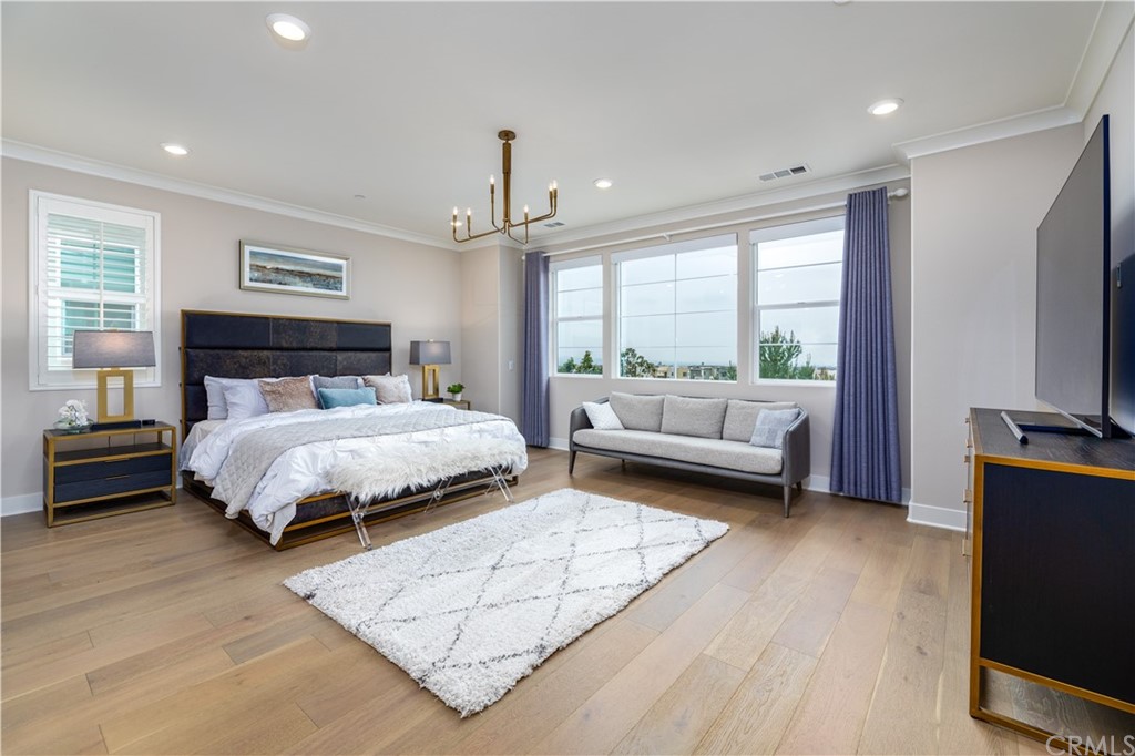 56 Swift Irvine, CA 92618 - Photo 15 of 43 a bedroom with a bed a couch and dresser